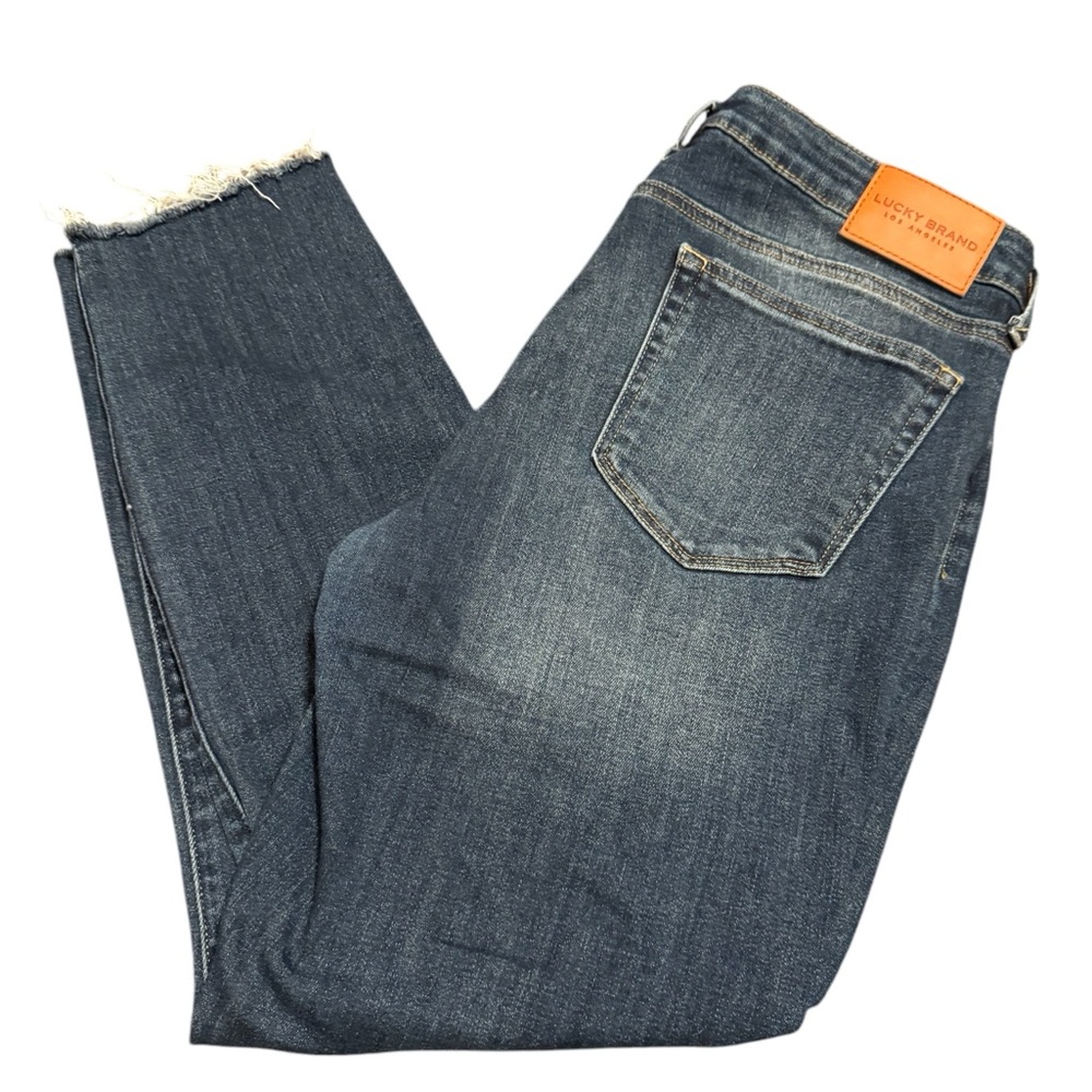 Lucky Brand medium wash blue denim jeans size 14 with frayed trim edges